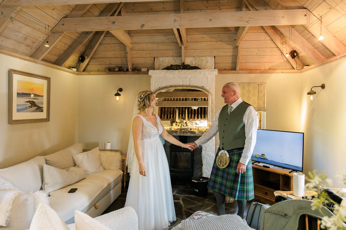 Couple getting ready for their elopement Elgol thatched cottage Isle of Skye